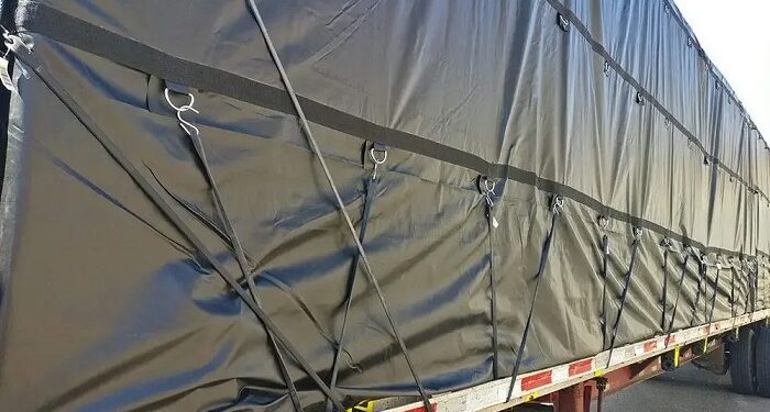 Flatbed-tarping techniques for aerospace components from Kentucky factories